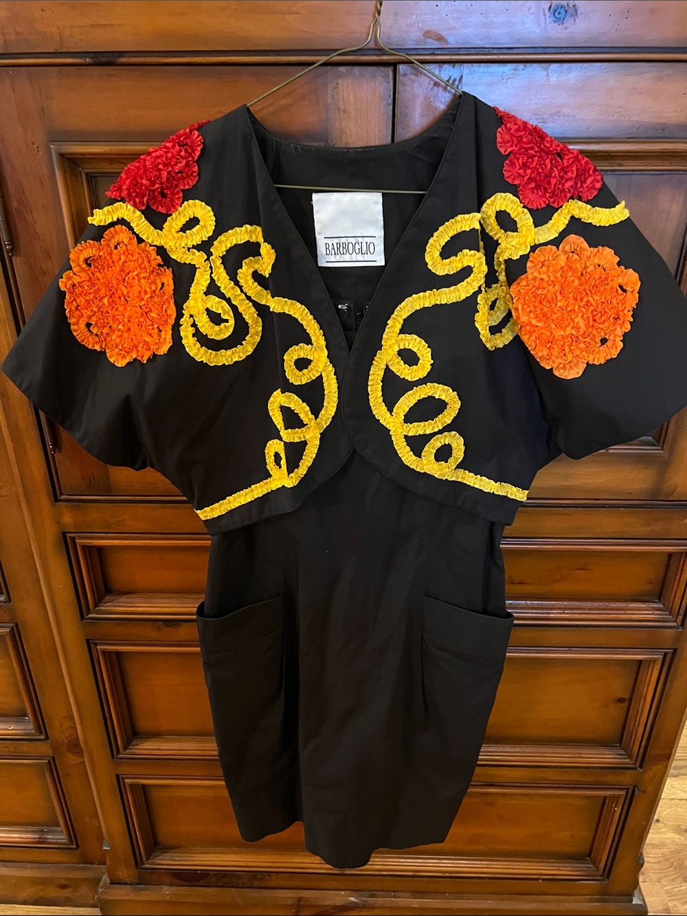 Black Dress with Yellow Trim and Orange & Red Floral Accents
